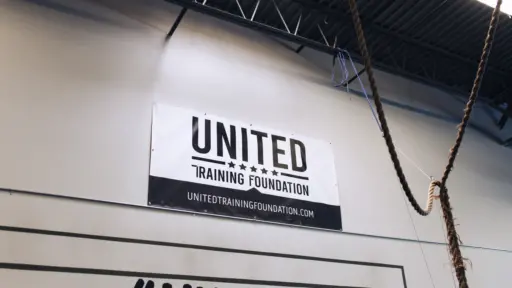 United Training Foundation banner on wall of gym